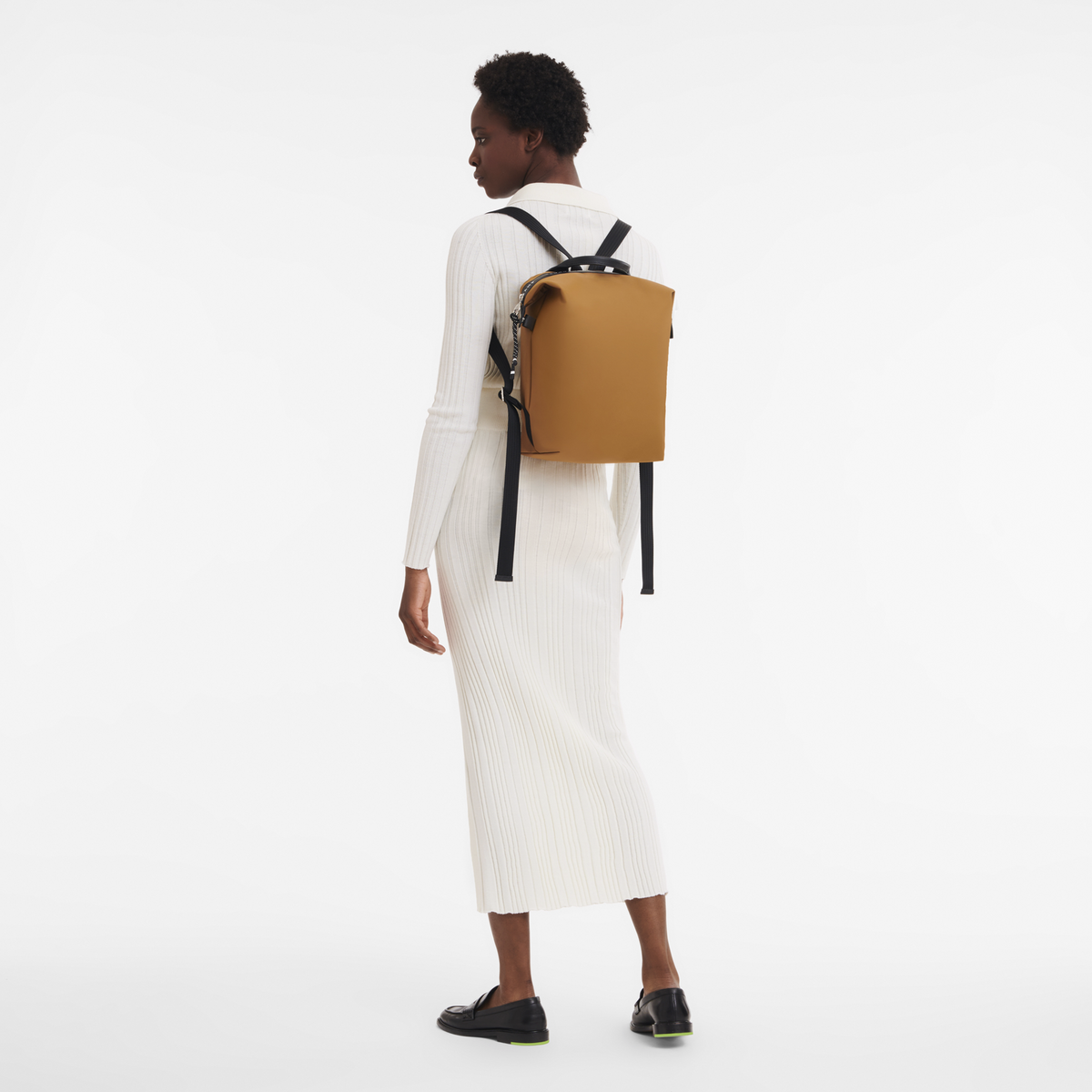 Longchamp Le Pliage Energy L Backpack in tobacco color with soft fabric and adjustable straps, shown from front view.