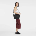 Longchamp Le Pliage Energy S handbag in black with sleek, compact design and rounded handles.