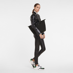 Longchamp Le Pliage Green L Tote Bag in black, showing the spacious design and durable fabric with handles for everyday use.