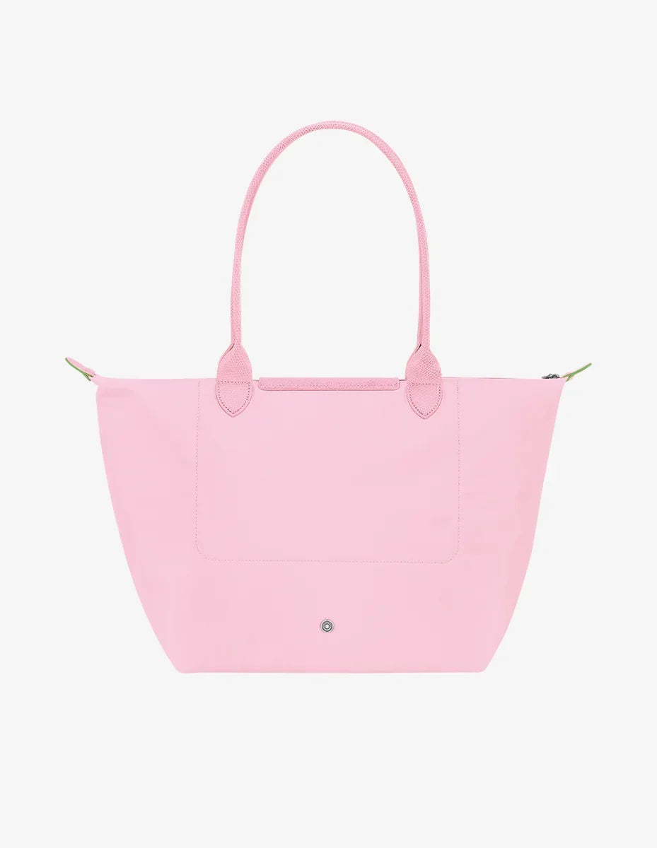 Longchamp Le Pliage green L tote bag with pink accents, showcasing its lightweight, foldable design and durable fabric.