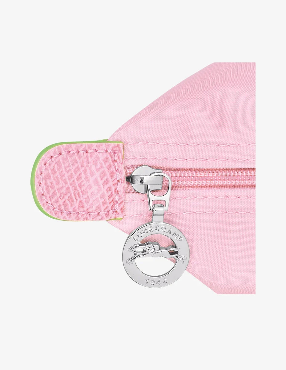 Longchamp Le Pliage Green L Tote bag in pink fabric with handles, showcasing its spacious design and sleek style.