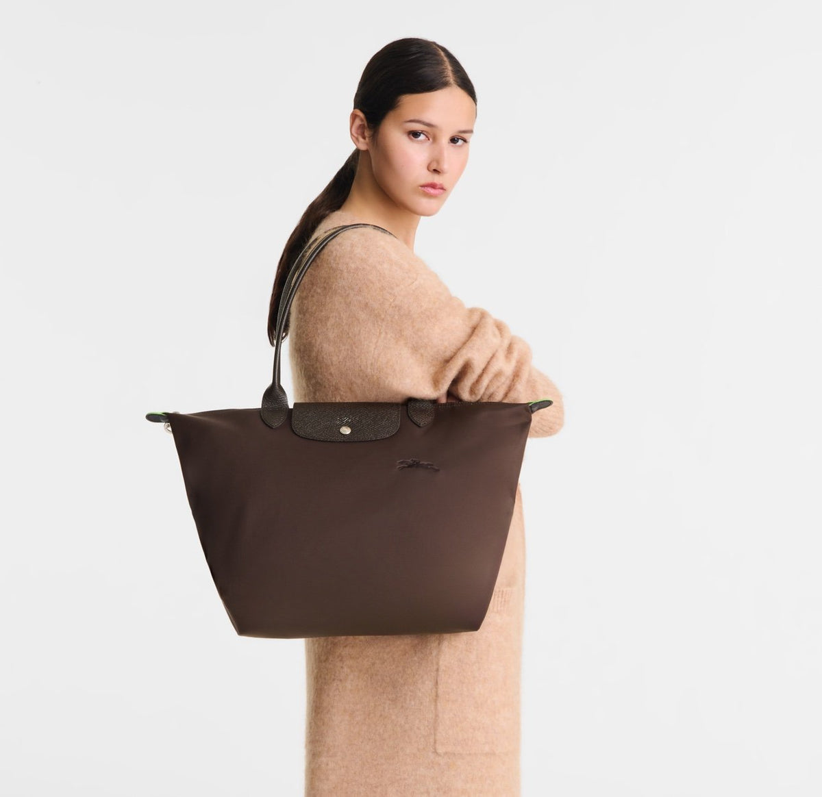 Longchamp Le Pliage Green L Tote bag in mocha color, showing the spacious tote with handles and logo detail.