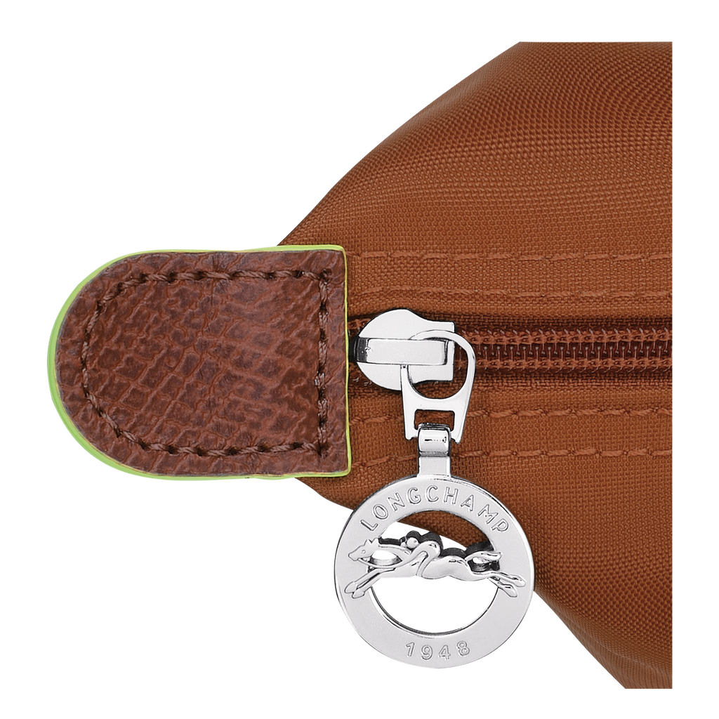 Longchamp Le Pliage Green M Tote bag in Cognac color, showing the folded fabric and sturdy handles.