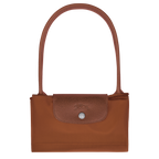 Longchamp Le Pliage Green M tote bag with cognac handles and accents, showcasing the stylish, foldable design on a neutral background.