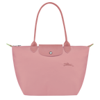 Longchamp Le Pliage Green M Tote bag with Petal Pink accents, showcasing its fabric material and spacious design.