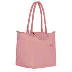 Longchamp Le Pliage Green M tote bag in Petal Pink with structured design and top handles, showcasing lightweight, foldable style.