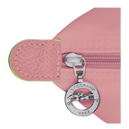 Longchamp Le Pliage Green M Tote bag with Petal Pink accents, showcasing durable fabric and stylish design.