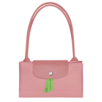 Longchamp Le Pliage green M tote bag with petal pink handles, showing the stylish and lightweight design.