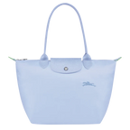 Longchamp Le Pliage Green M tote bag with sky blue accents, showcasing its lightweight, foldable design and durable fabric.