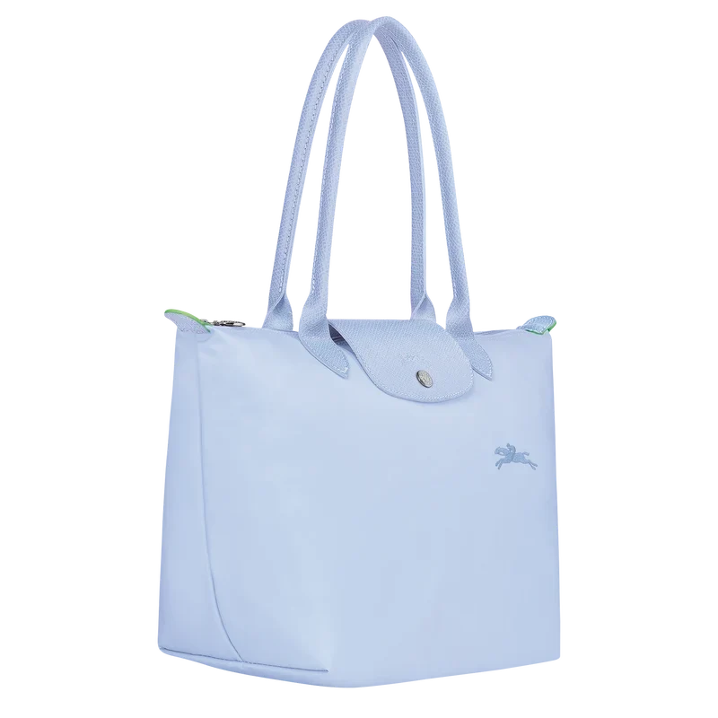 Longchamp Le Pliage Green M tote bag in sky blue, lightweight and foldable, with durable fabric and leather handles.