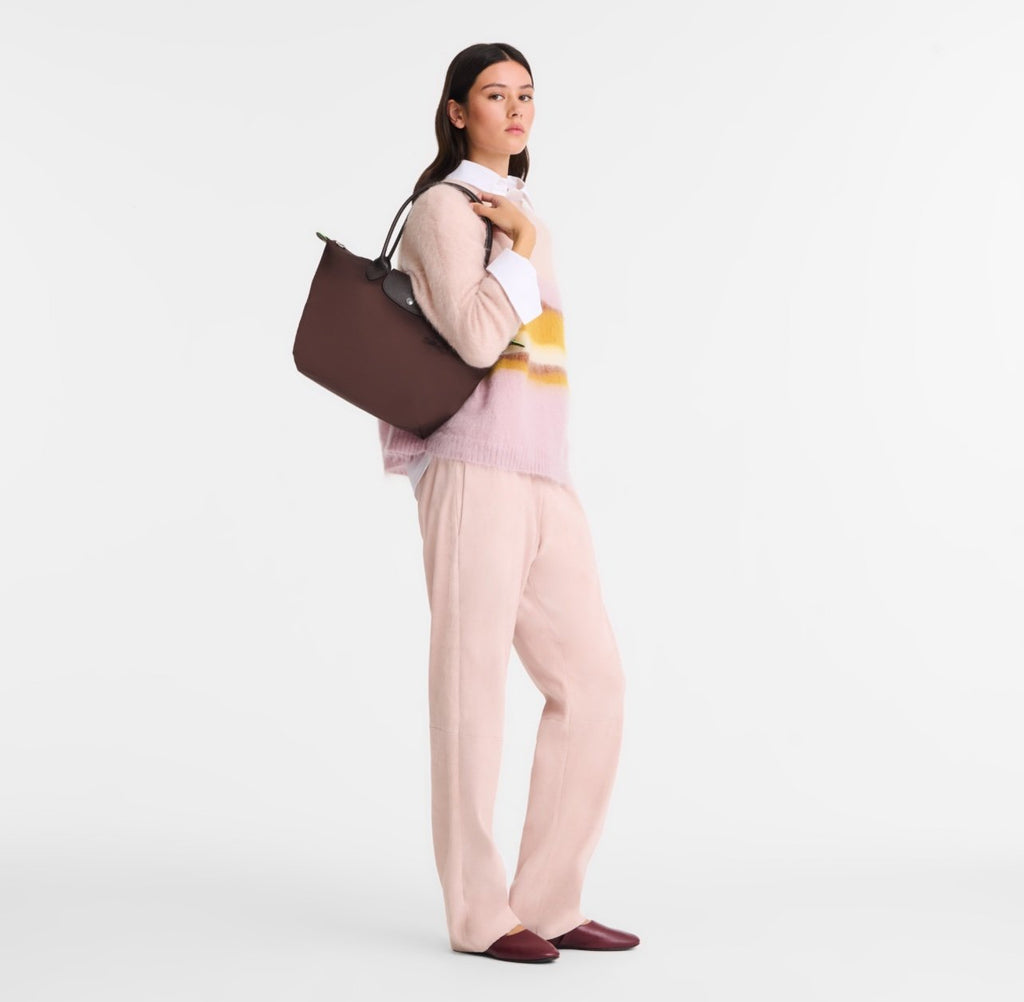 Longchamp Le Pliage Green M tote bag in mocha with sturdy handles and compact design, perfect for everyday carrying.