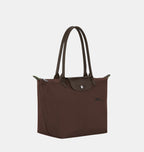 Longchamp Le Pliage Green M Tote bag in Mocha, showing the foldable fabric design and sturdy handles.