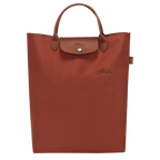 Longchamp Le Pliage Green M Tote bag with vertical chestnut accents, showcasing durable fabric and sleek design.