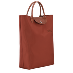 Longchamp Le Pliage Green M Tote bag with vertical chestnut design, showcasing the lightweight, foldable fabric and sturdy handles.