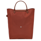 Longchamp Le Pliage Green M Tote bag with vertical chestnut design, showing the durable fabric and classic style.