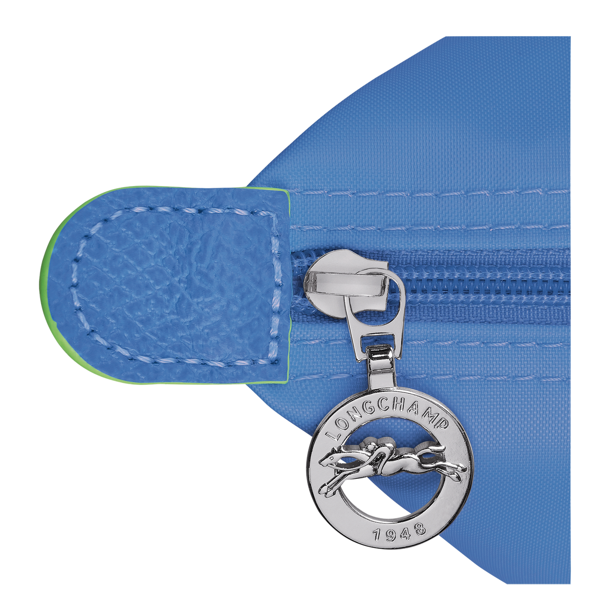 Longchamp Le Pliage green pouch with handle, featuring a cornflower blue color, compact bag with a sleek design and fabric texture.