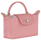 Longchamp Le Pliage green pouch bag with handle and petal pink accents, showcasing a compact and stylish accessory.