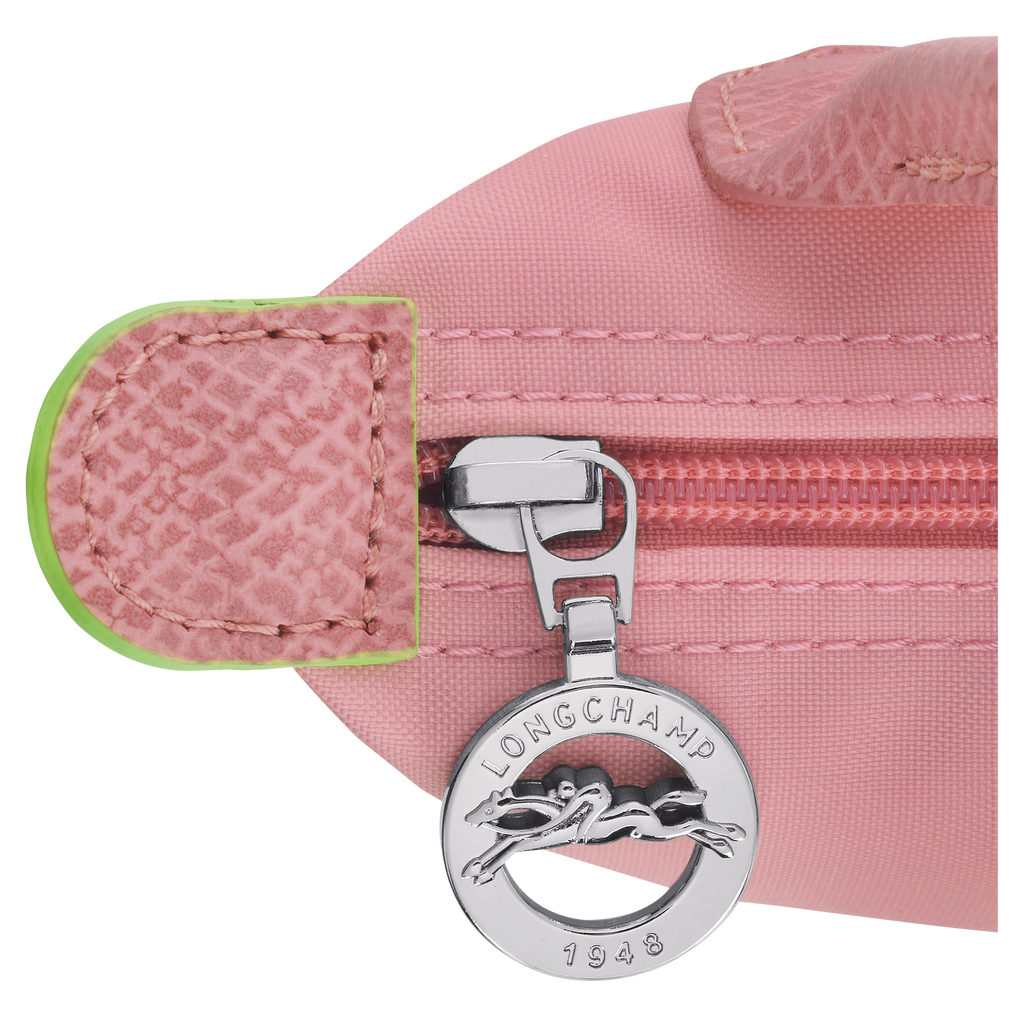 Longchamp Le Pliage green pouch bag with handle and petal pink accents, lightweight and versatile accessory.