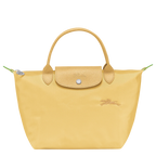 Longchamp Le Pliage Green S handbag in wheat color, featuring a compact, foldable design with leather handles and nylon body.