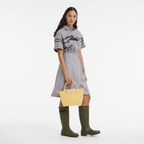 Longchamp Le Pliage Green S Handbag in Wheat color, showing the stylish foldable bag with leather accents and handle.