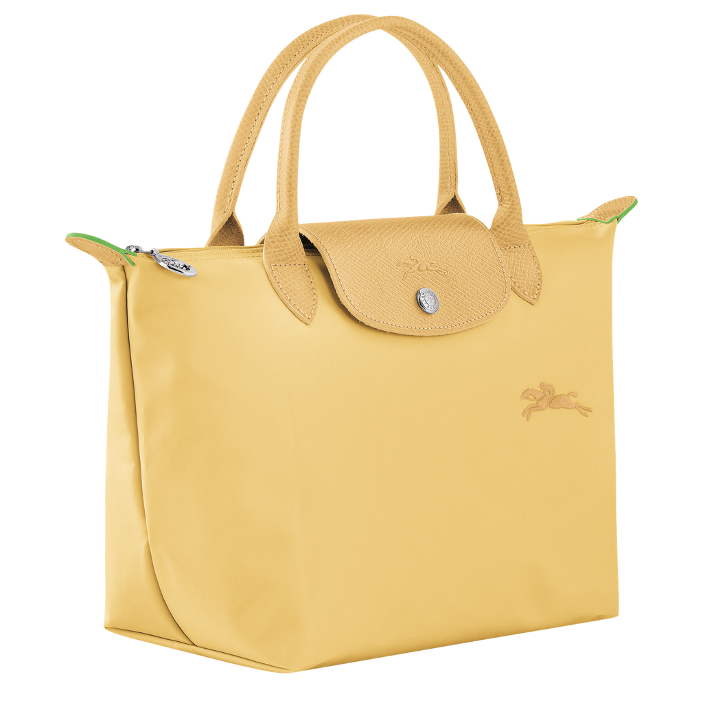 Longchamp Le Pliage Green S handbag in wheat color, showcasing the compact, foldable leather bag with handles and subtle branding.
