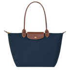 Longchamp Le Pliage Original L tote bag in navy with durable nylon fabric and leather handles, shown from a side angle.
