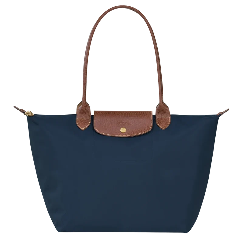 Longchamp Le Pliage Original L tote bag in navy, showing its durable nylon fabric and leather handles with foldable design.