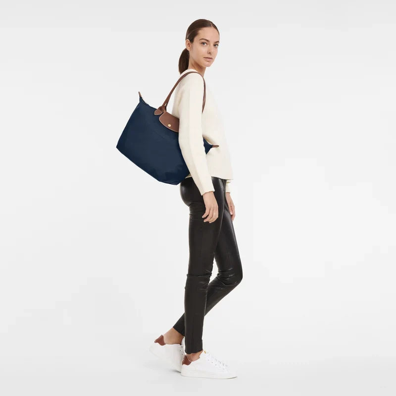 Longchamp Le Pliage Original L Tote bag in navy, showing the lightweight nylon design with leather handles and subtle branding.