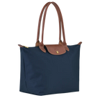 Longchamp Le Pliage Original L tote bag in navy, lightweight nylon with leather handles and classic foldable design.