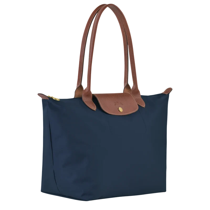 Longchamp Le Pliage Original L tote bag in navy, lightweight nylon with leather handles and classic foldable design.