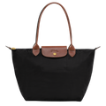 Longchamp Le Pliage Original M Tote bag in black, showing the lightweight, foldable design with sturdy handles and sleek finish.