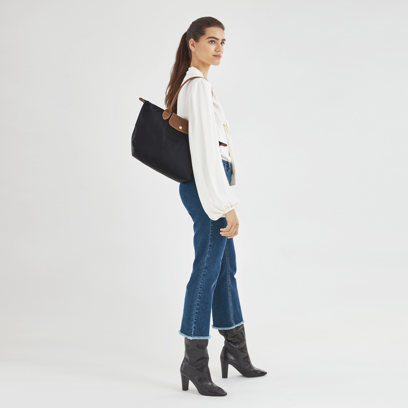 Longchamp Le Pliage Original M Tote bag in black, showing its classic design and durable material.