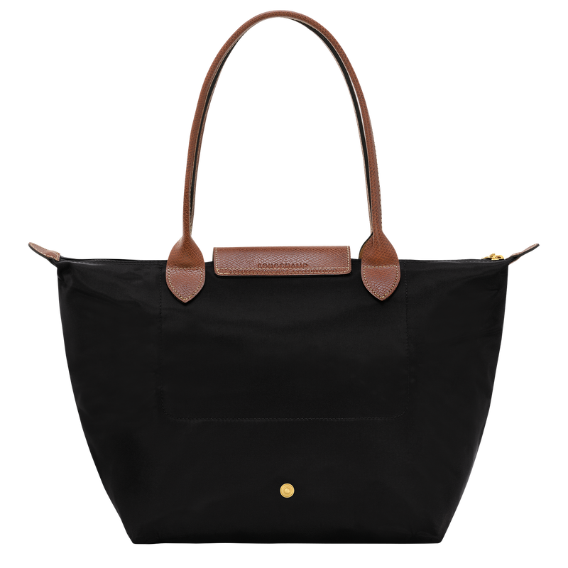 Longchamp Le Pliage Original M tote bag in black, showcasing its sleek design and durable fabric on a plain background.