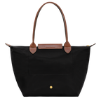 Longchamp Le Pliage Original M tote bag in black, showcasing its sleek design and durable fabric on a plain background.