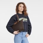 Longchamp Le Pliage Original M Tote bag in ebony with durable nylon fabric and leather handles, stylish and lightweight.