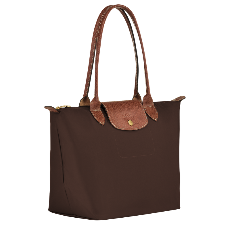Longchamp Le Pliage Original M Tote bag in ebony with nylon and leather handles, showcasing its compact, foldable design.