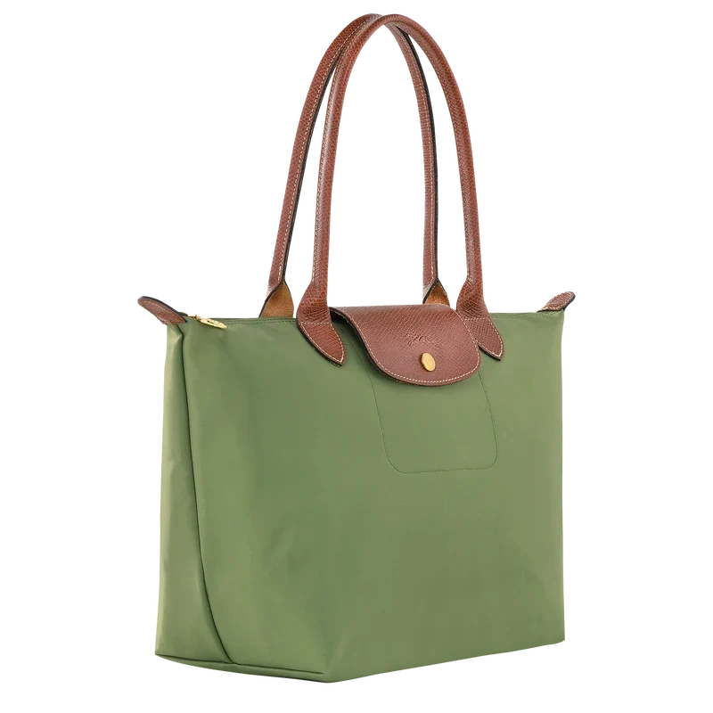 Longchamp Le Pliage Original M Tote bag in Lichen color, showing the durable fabric and classic design with leather handles.