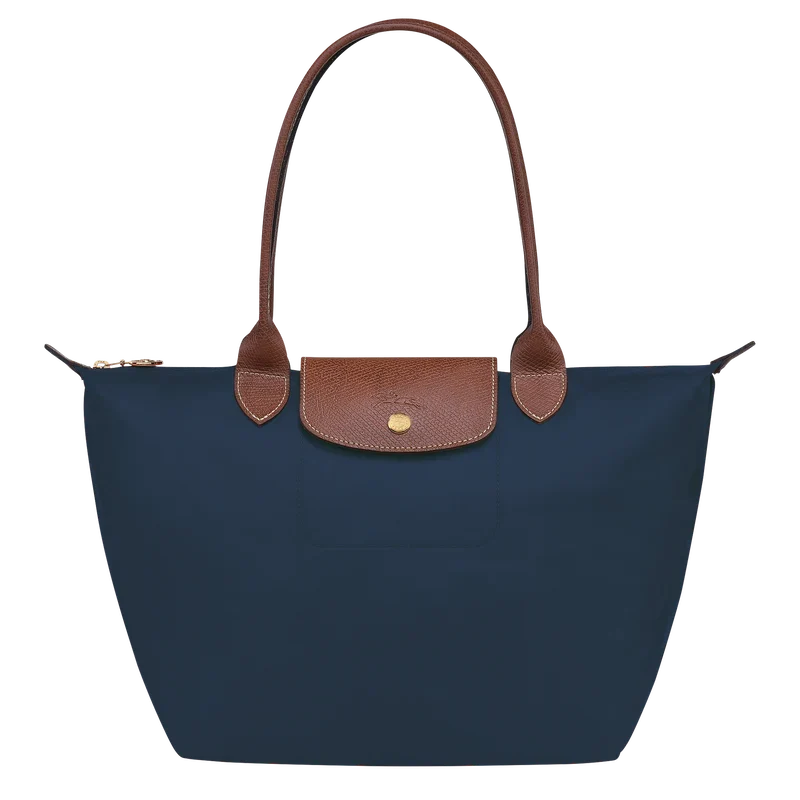 Longchamp Le Pliage Original M Tote Bag in navy with nylon and leather handles, showcasing its foldable design and spacious interior.