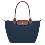 Longchamp Le Pliage Original M Tote Bag in navy with nylon and leather handles, showcasing its foldable design and spacious interior.