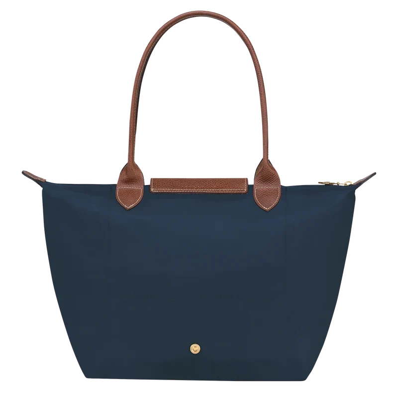 Longchamp Le Pliage Original M Tote Bag in navy with leather handles and foldable design, showcasing its stylish and functional look.
