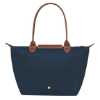 Longchamp Le Pliage Original M Tote Bag in navy with leather handles and foldable design, showcasing its stylish and functional look.