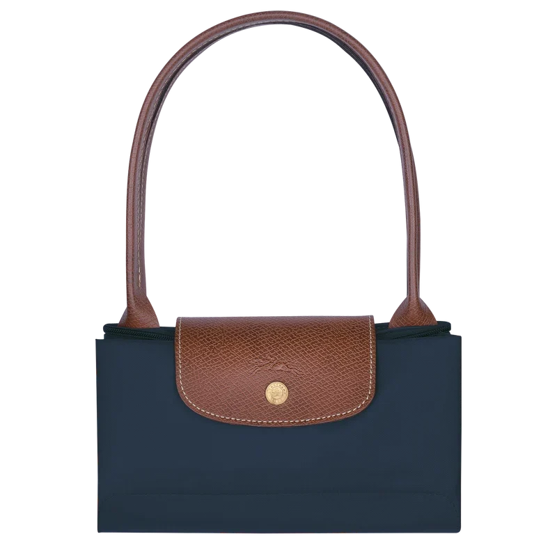 Longchamp Le Pliage Original M tote bag in navy color, showcasing its lightweight design and durable fabric.