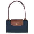 Longchamp Le Pliage Original M tote bag in navy color, showcasing its lightweight design and durable fabric.