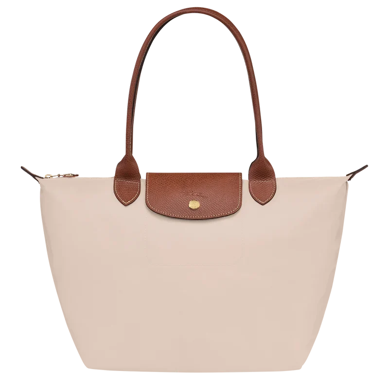 Longchamp Le Pliage Original M Tote bag in wine paper material, showcasing its compact, foldable design with sturdy handles.