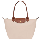 Longchamp Le Pliage Original M Tote bag in wine paper material, showcasing its compact, foldable design with sturdy handles.
