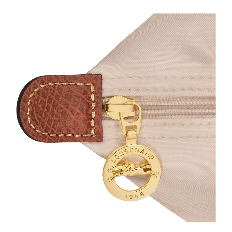 Longchamp Le Pliage Original M tote bag in wine paper material, showcasing its compact foldable design and durable fabric.