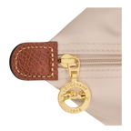 Longchamp Le Pliage Original M tote bag in wine paper material, showcasing its compact foldable design and durable fabric.