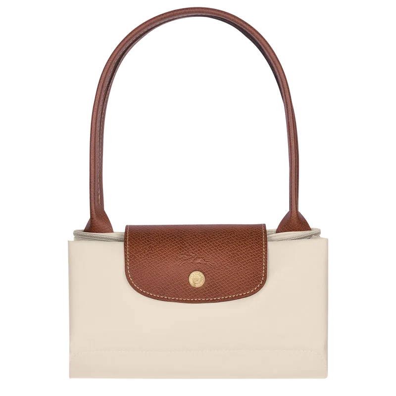Longchamp Le Pliage Original M Tote bag in wine paper material, showcasing its sleek design and compact foldability.