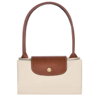 Longchamp Le Pliage Original M Tote bag in wine paper material, showcasing its sleek design and compact foldability.