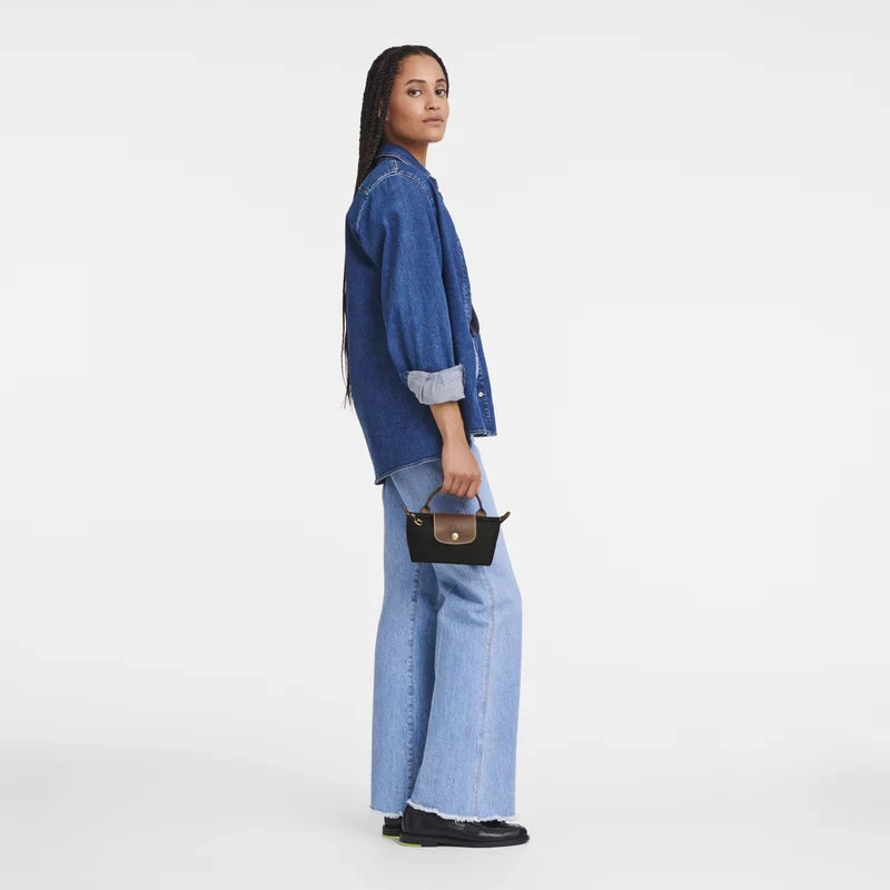 Longchamp Le Pliage Original pouch with handle in black, featuring compact, lightweight design and durable nylon material.